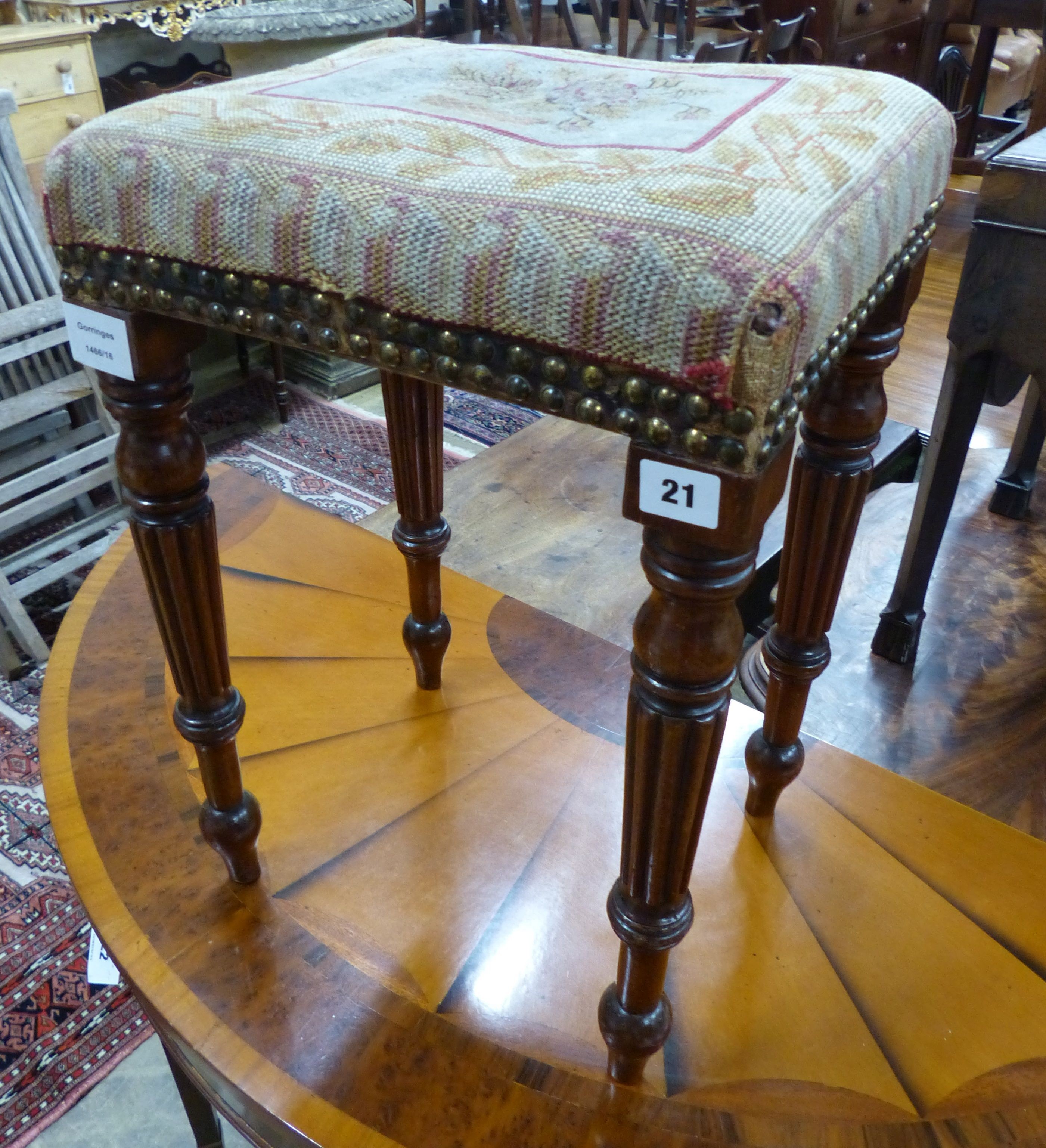 A small Regency mahogany upholstered stool, on fluted legs, W.35cm D.29cm H.51cm